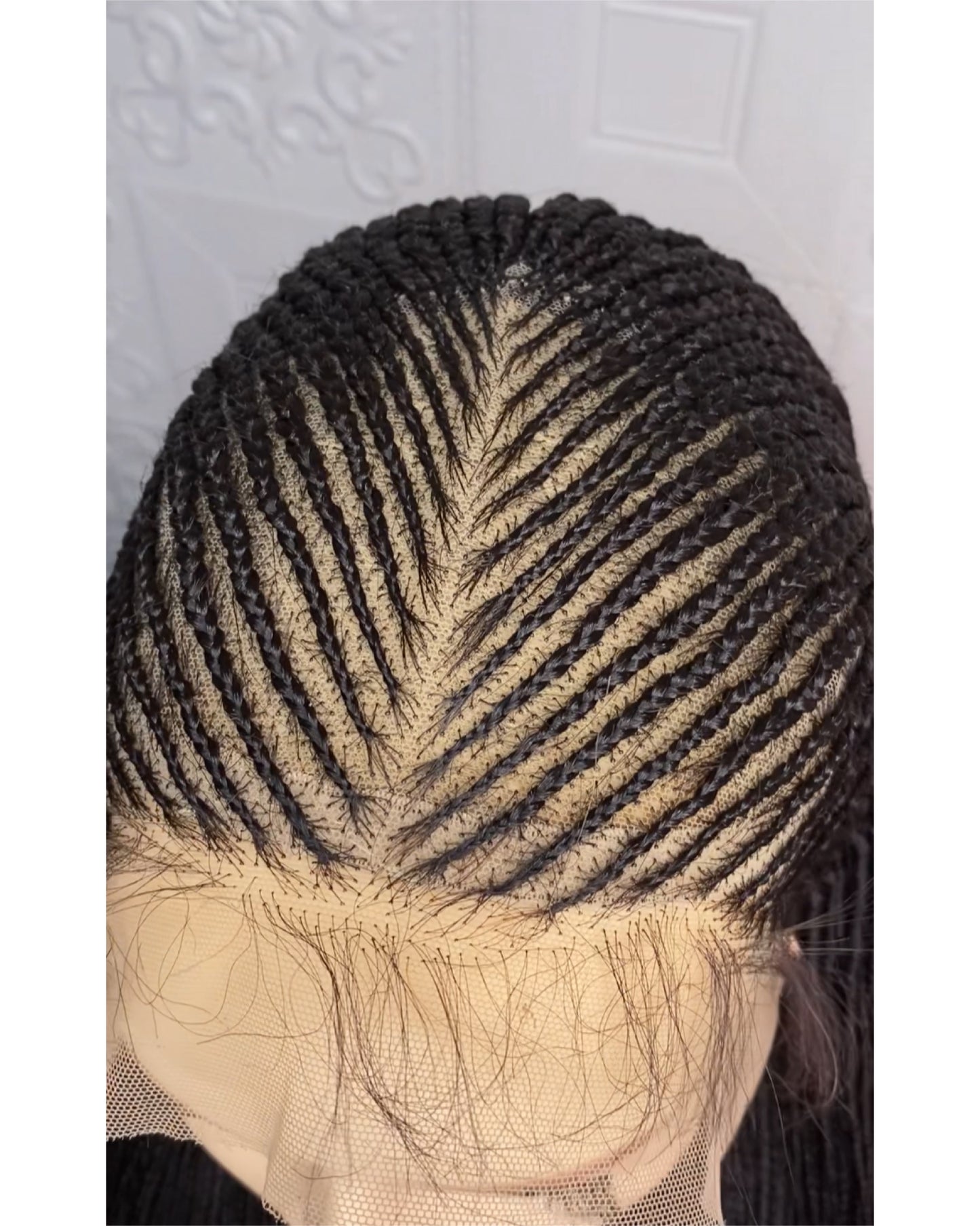 Defined center part cornrows